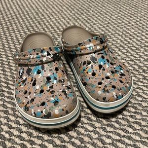 Women’s 8 & Men’s 6 Crocs! tan with colorful design.